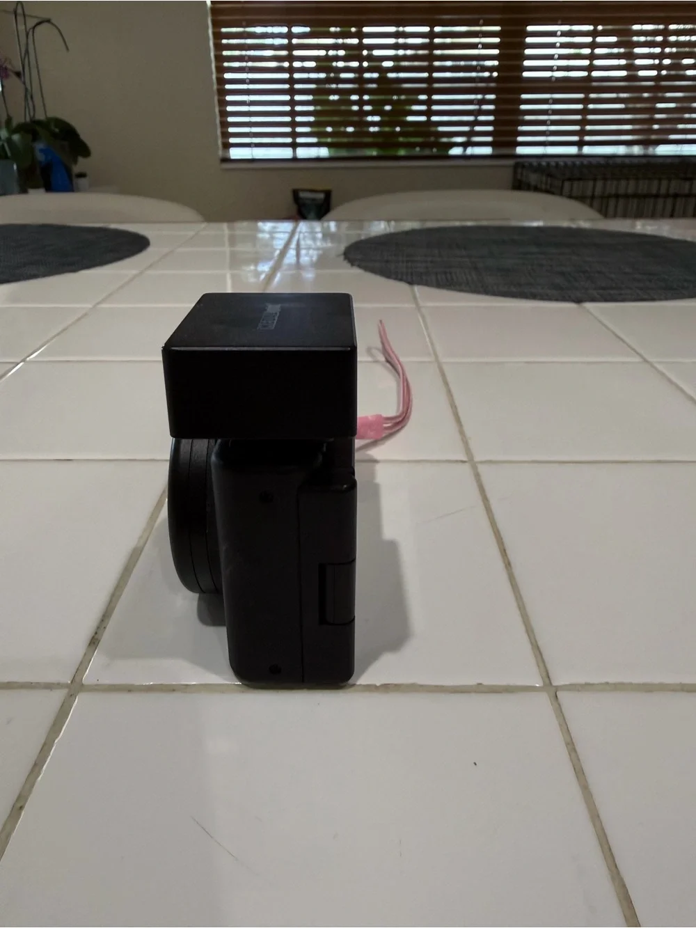 Sony Black Compact Digital Camera with Detachable Flash and Pink Strap